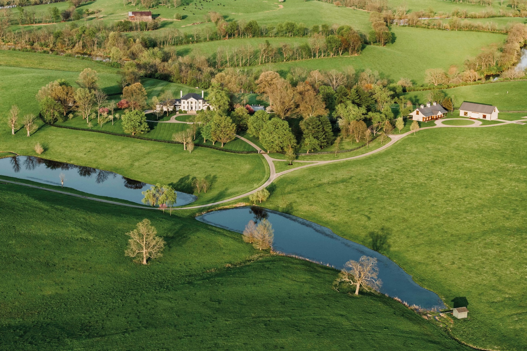 Aerial view of Augustus Hill Farm estate, ponds and manor house