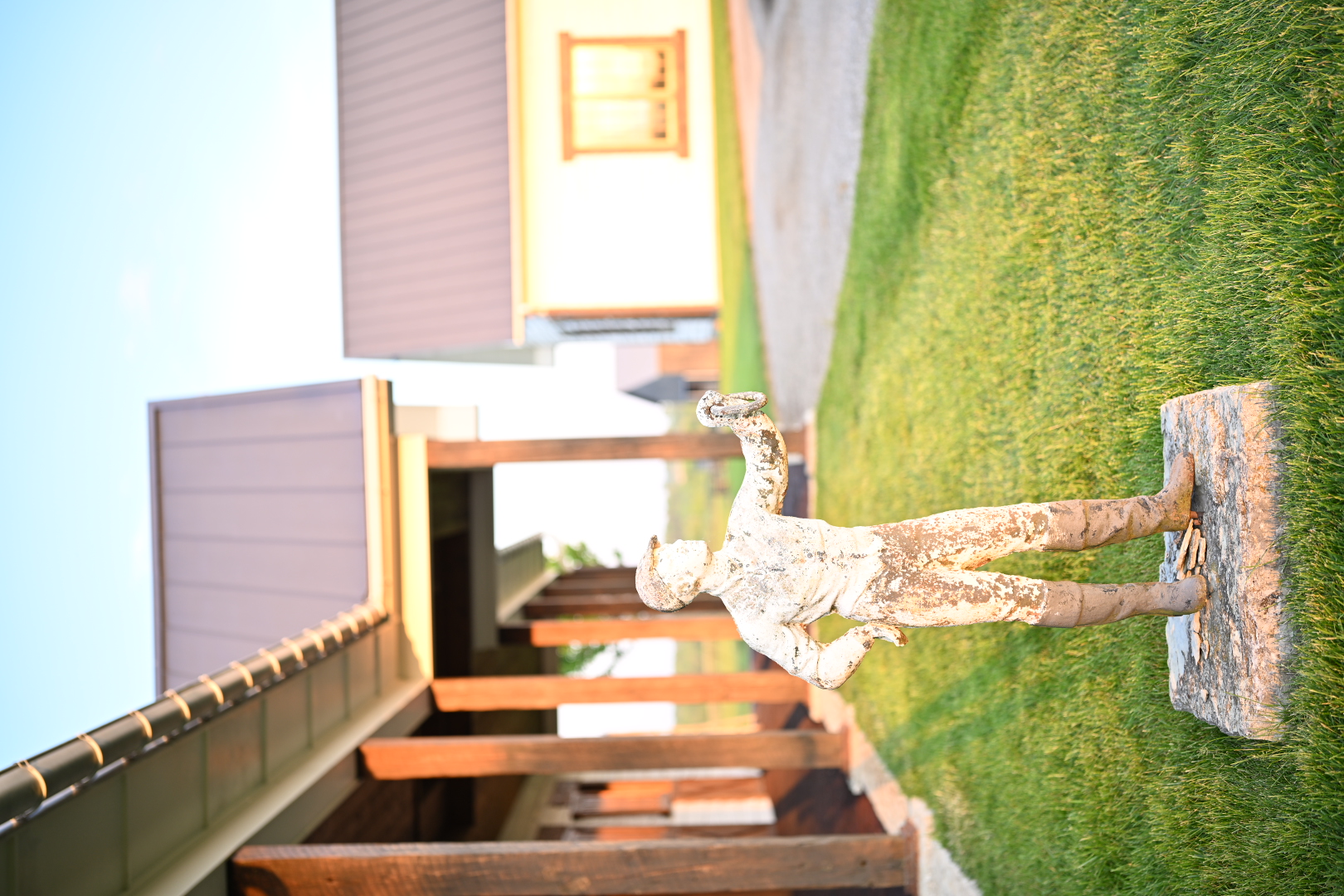 Equestrian statue outside the stable buildings at golden hour